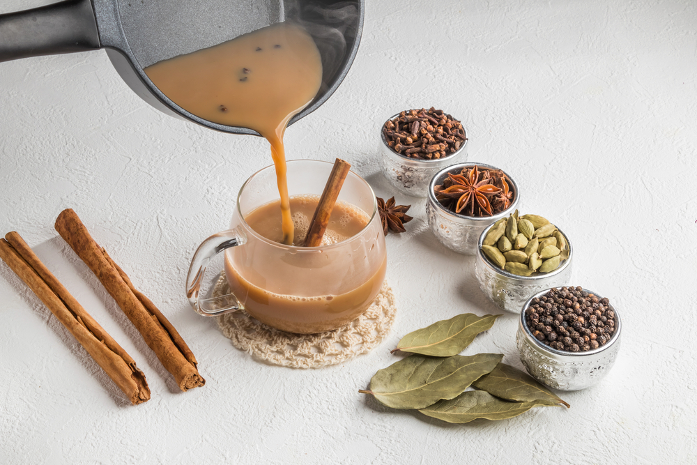 A cup of Masala chai and its ingredients
