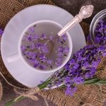 Aromatic Lavender White Tea in a cup a bouquet of fresh lavender flowers.