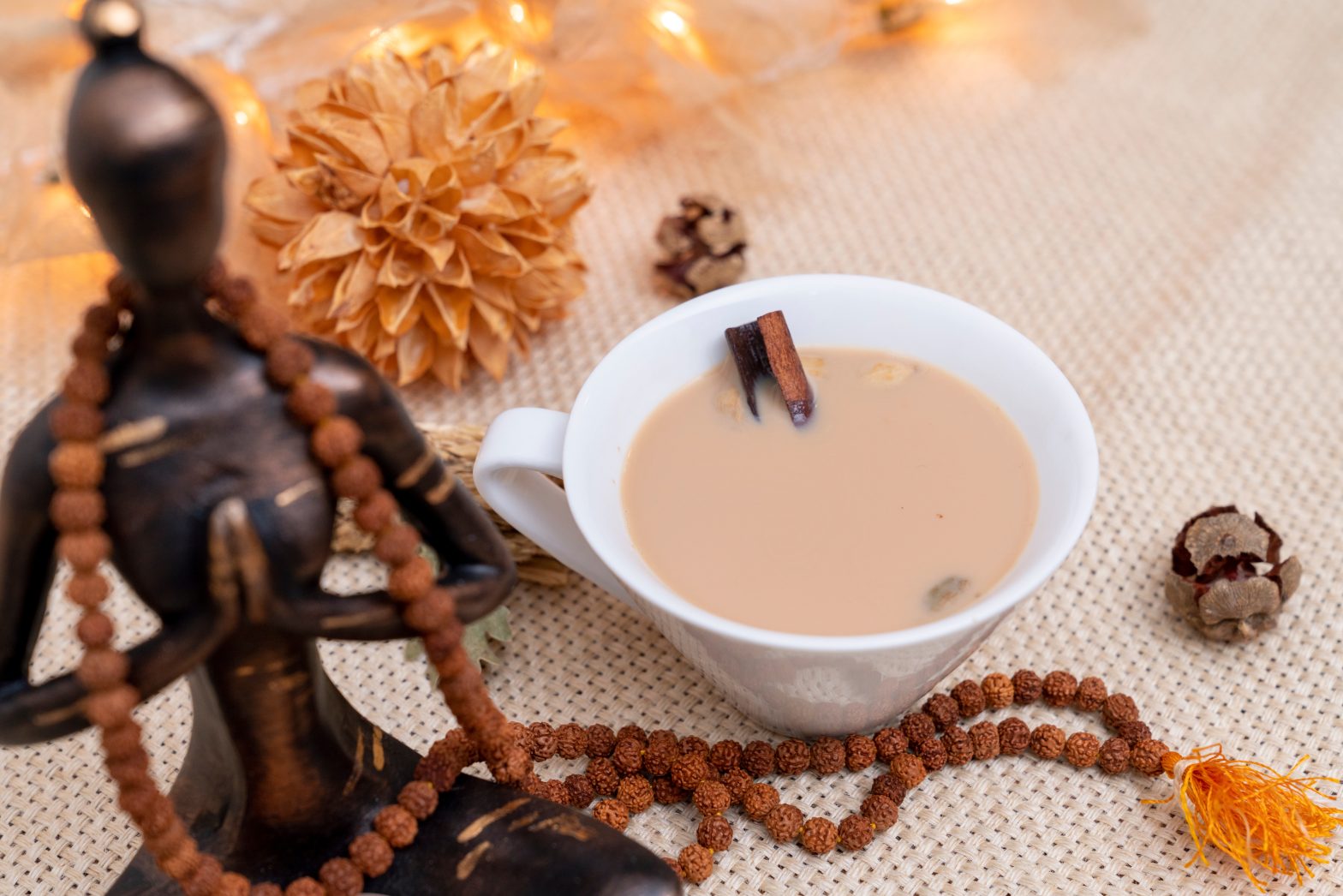 Yogi cinnamon tea on meditation. Healthy and relaxing life concept.