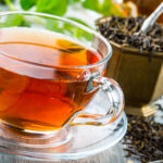 Ceylon Tea in a glass cup on a slate plate