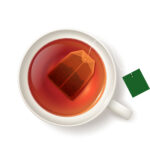 Teacup with orange pekoe tea bags