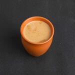 cardamom tea on dark background.