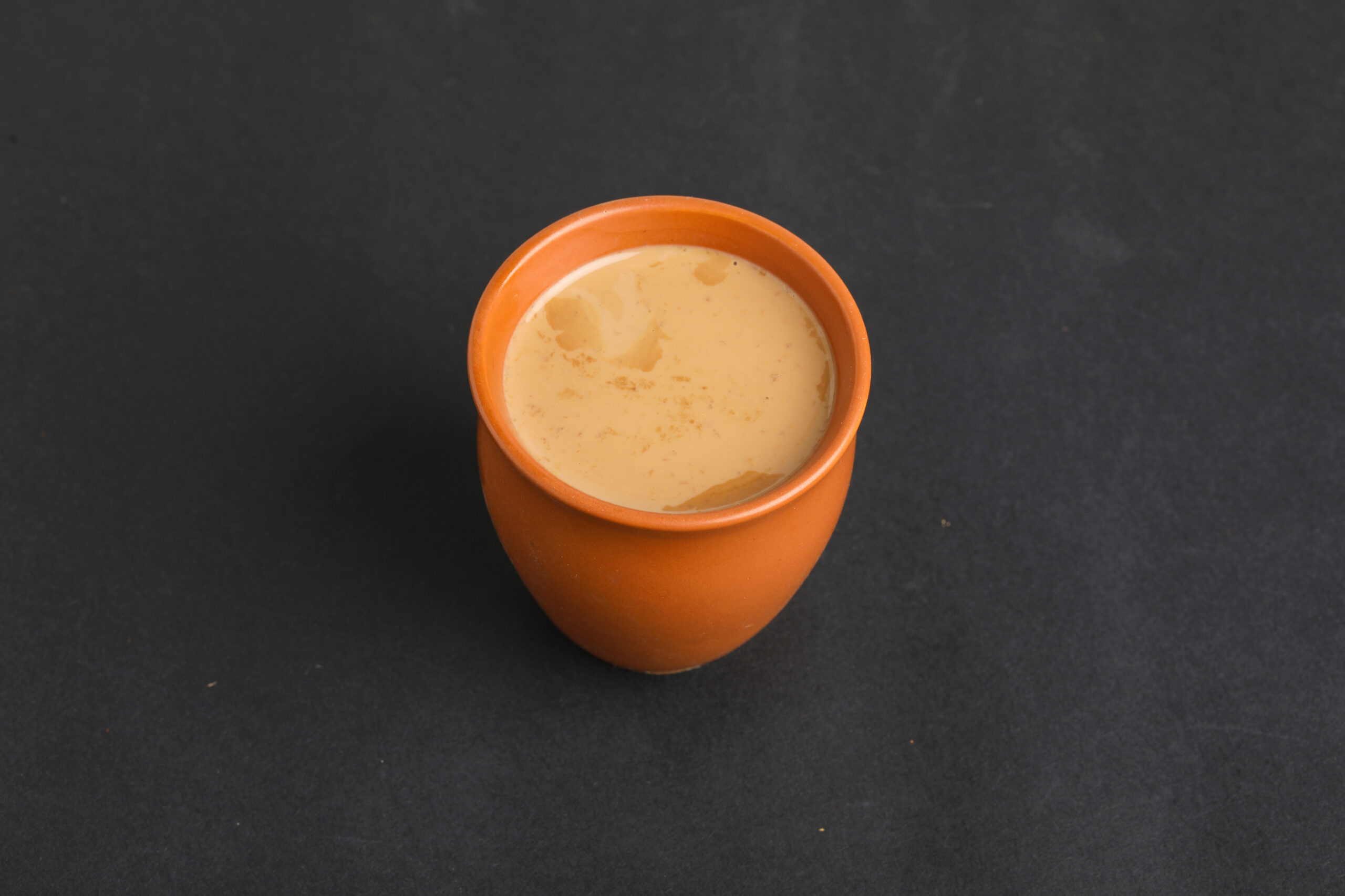 cardamom tea on dark background.